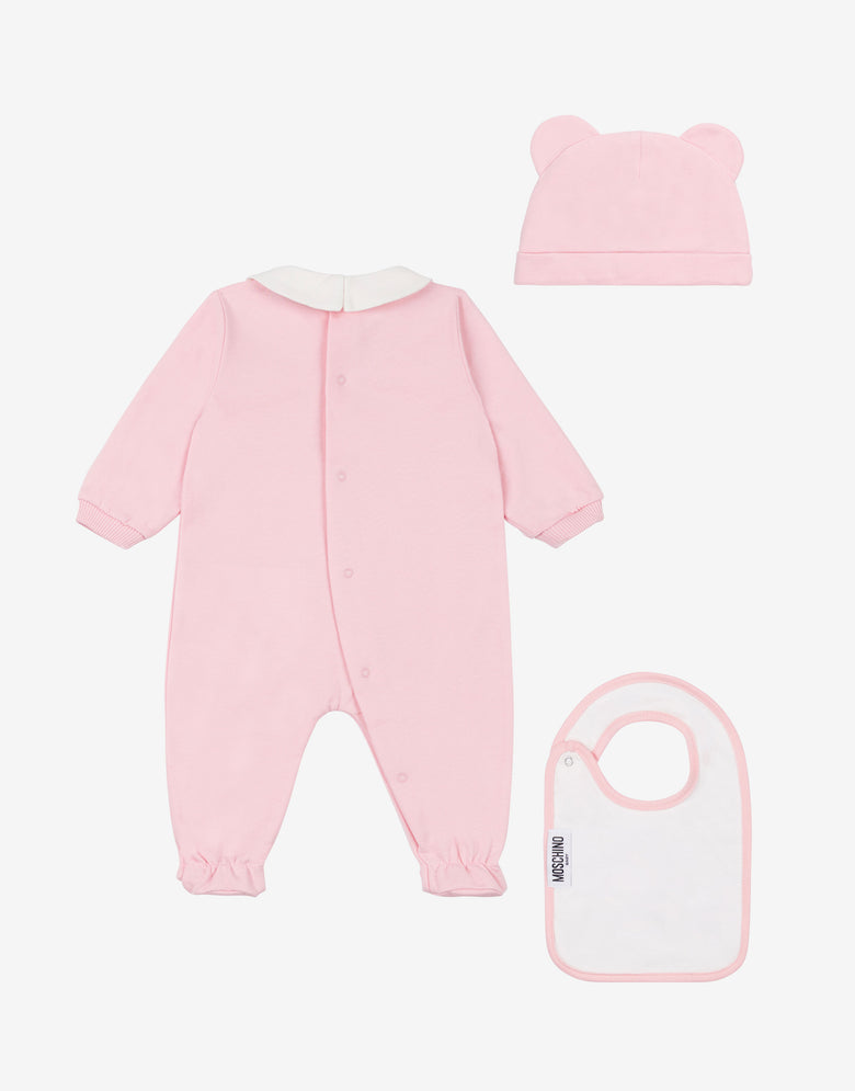 Ensemble composé d'une grenouillère, d'un bavoir et d'un bonnet en molleton de coton Rose Moschino 1