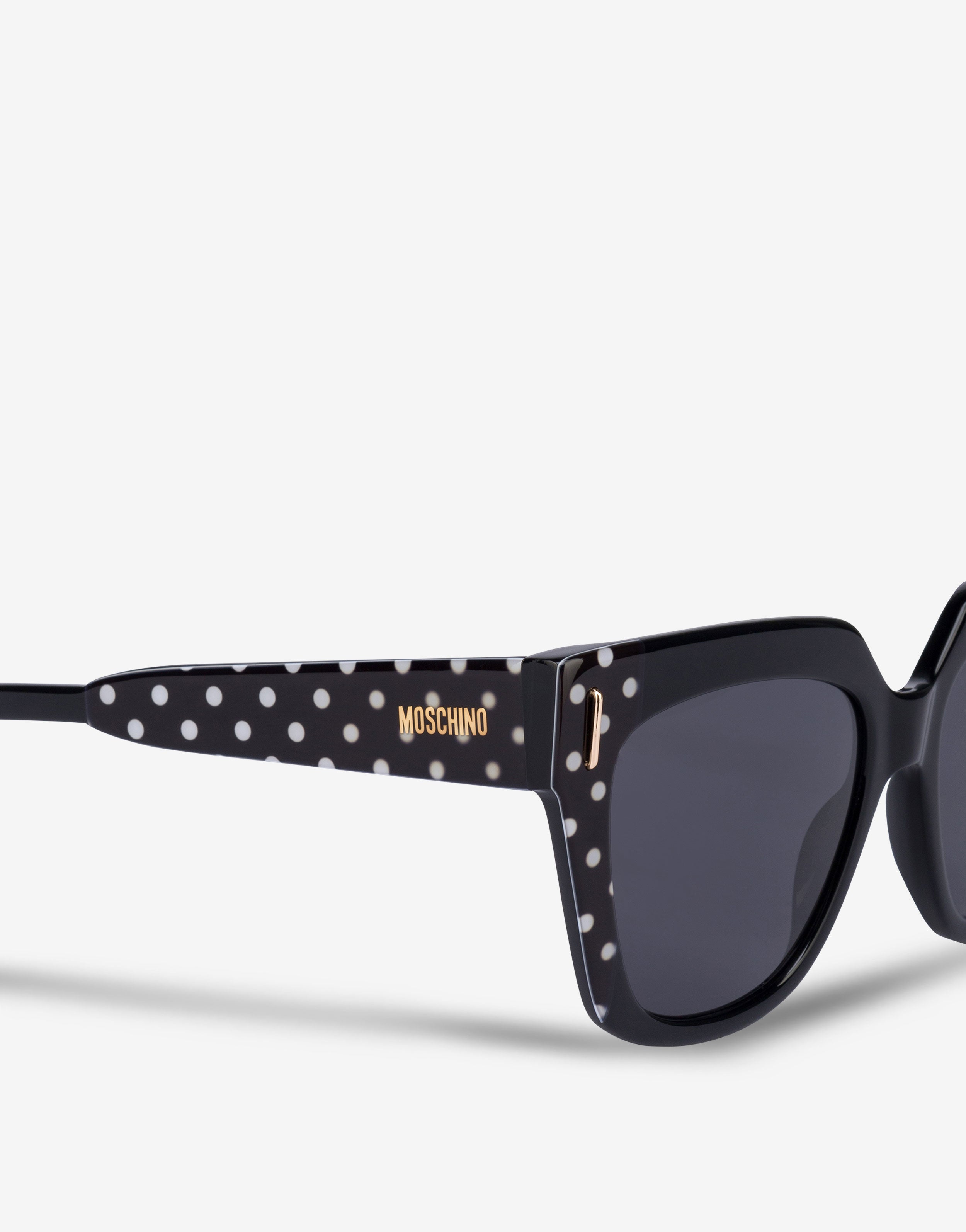 MOSCHINO ブラック リボンモチーフのケースとゴルチェのサングラス Sunglasses with a paperclip detail | Moschino
