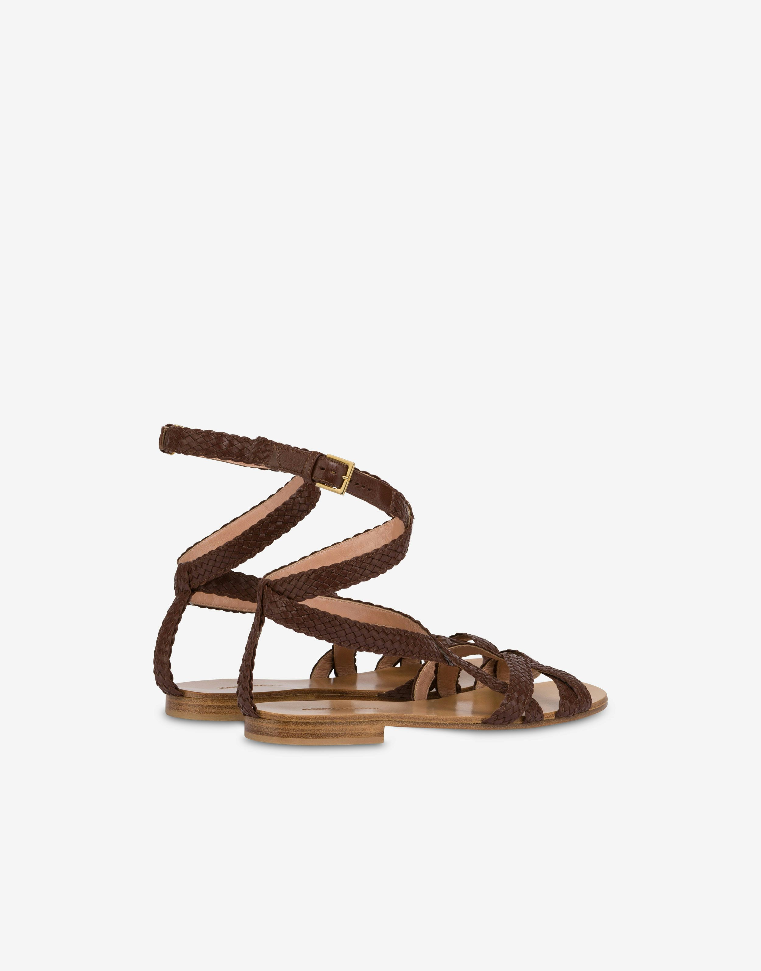 Flat sandals in braided calfskin